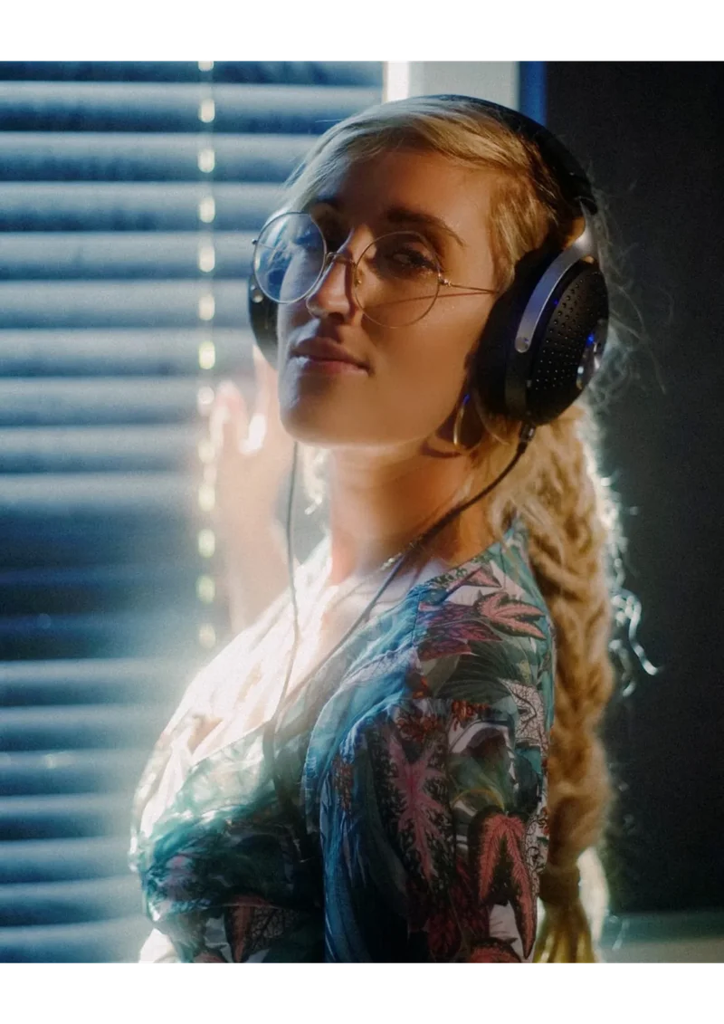 Intimate close-up of reggae vocalist singing passionately into a vintage Neumann condenser microphone