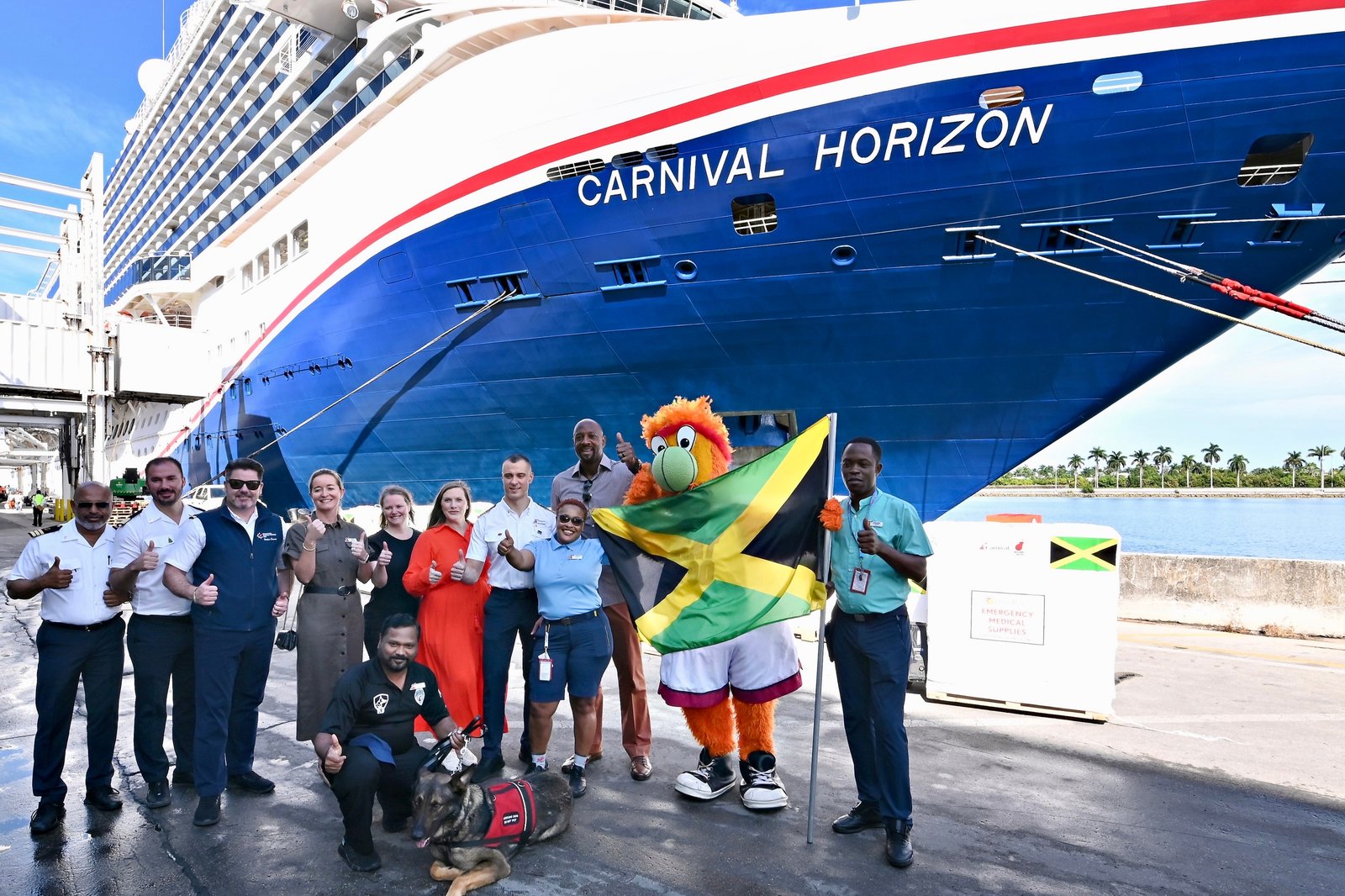 Workers unloading pallets of relief supplies from a cruise ship at a Jamaican port