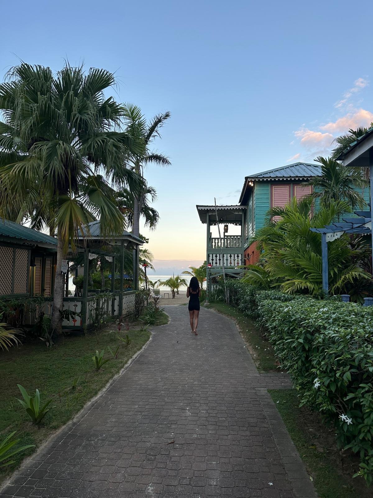 A beautiful Jamaican resort beach at sunrise, ready to welcome visitors