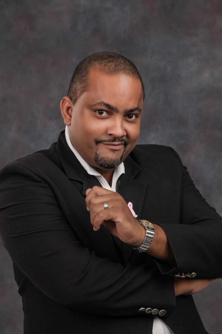 An elegant awards ceremony red carpet scene in Jamaica