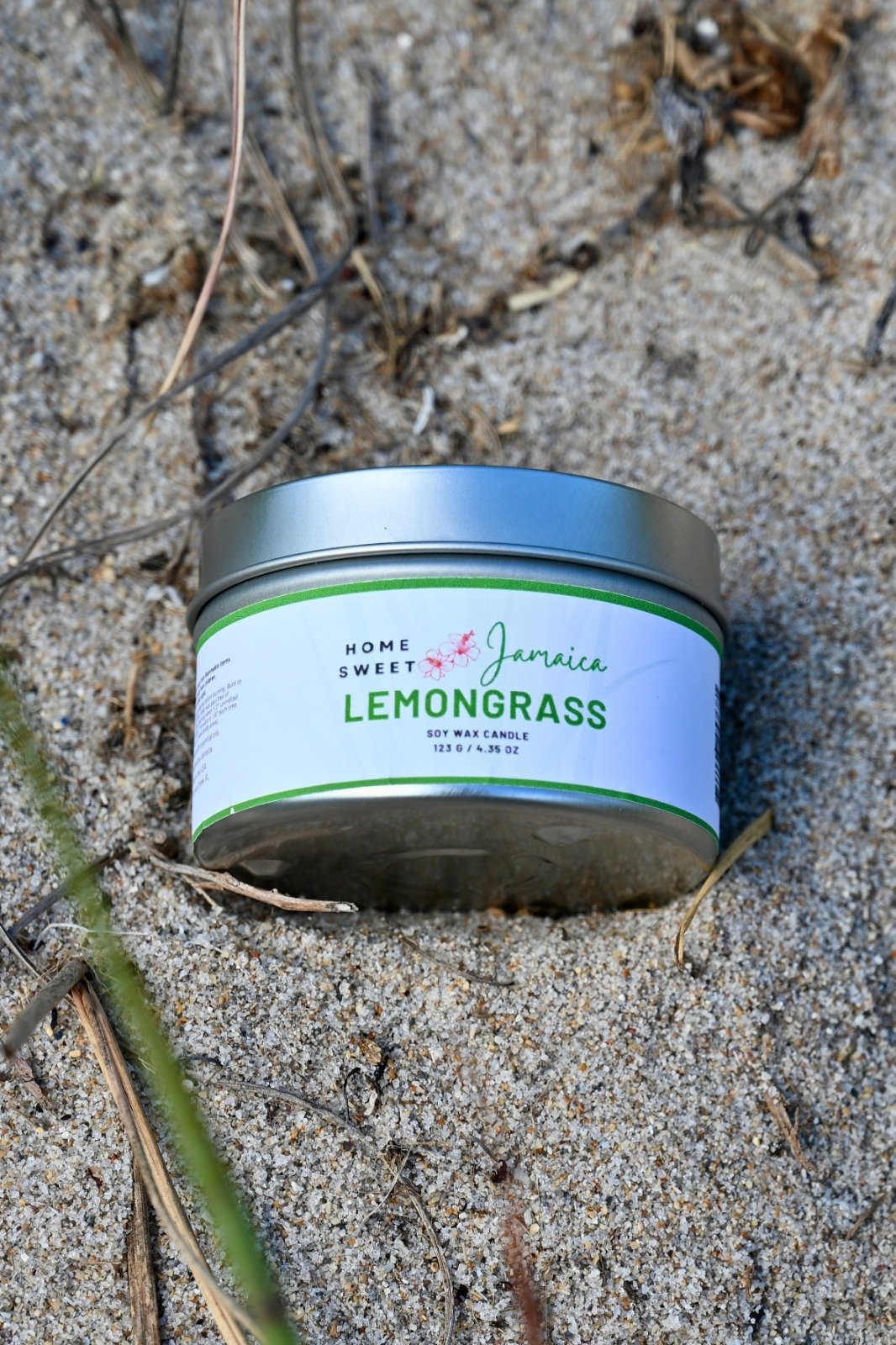 Lemongrass candle on beach