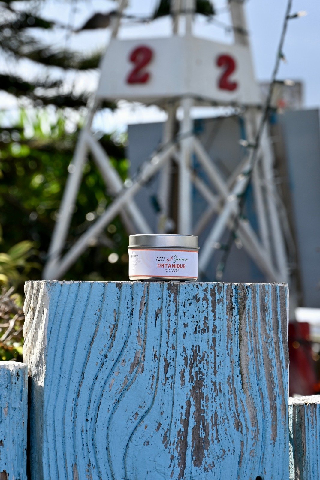 Ortanique candle on fence